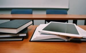 university table with ipad and books