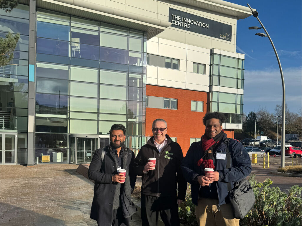 eb5c92c0-3ab0-4781-9aa0-ad61b4ef127e Tahmid Ahmed and Joel Wilson from Lenovo with Gary Dodson from Greenlight Computers standing outside The Innovation Centre at Sci-Tech Daresbury
